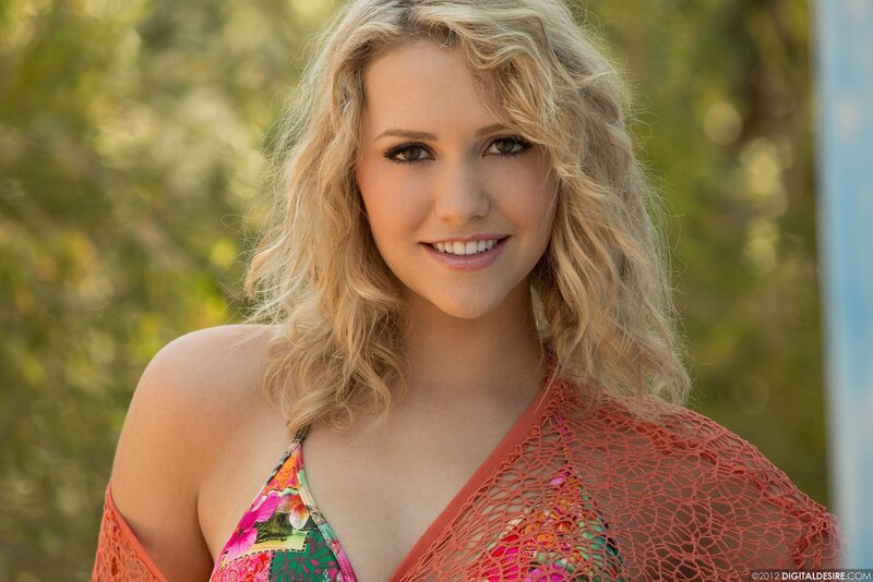 woman in floral top smiling