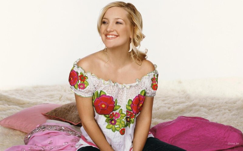 woman in floral top smiling