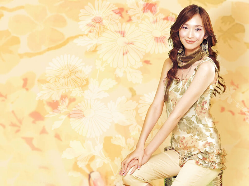 woman in floral top smiling