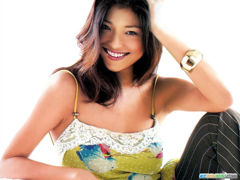 woman in floral top smiling