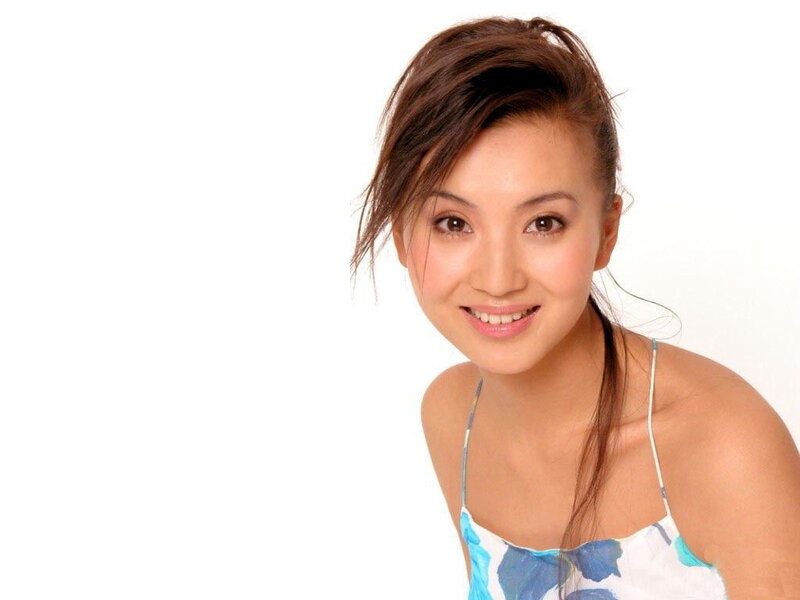 woman in floral top smiling
