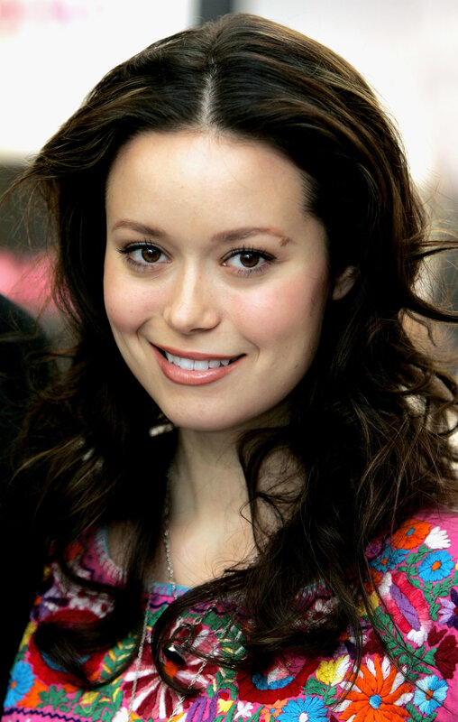 woman in floral top smiling