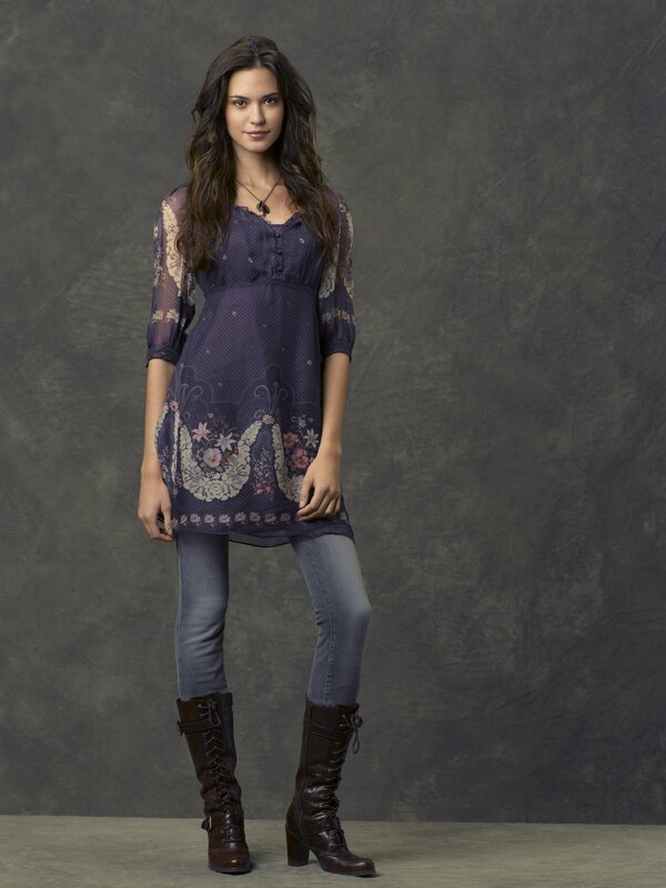 woman in floral tunic and boots