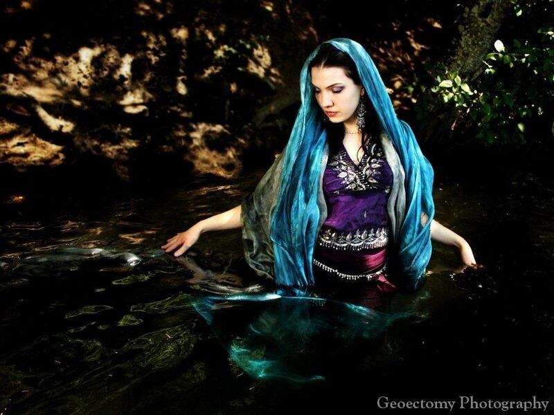 Woman in Flowing Blue Veil