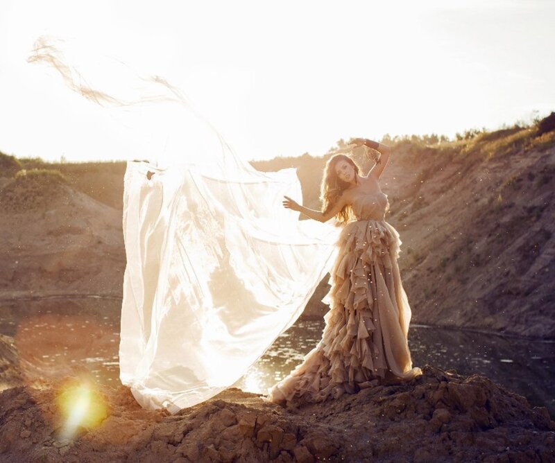Woman in Flowing Dress — White, Dramatic, Sunset, Photograph, Fabric