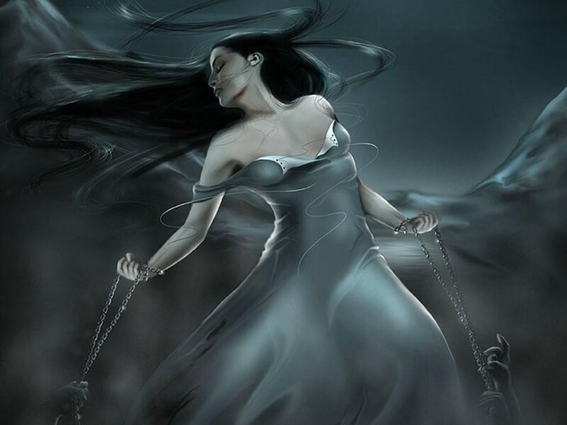 woman in flowing dress with chains