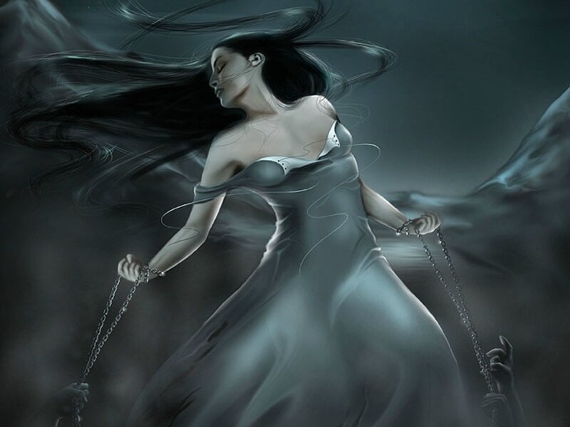 woman in flowing dress with chains