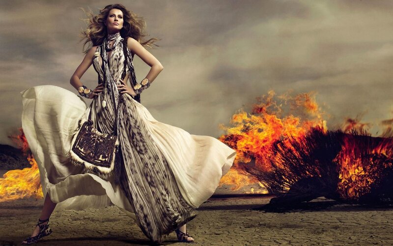 woman in flowing dress with fire