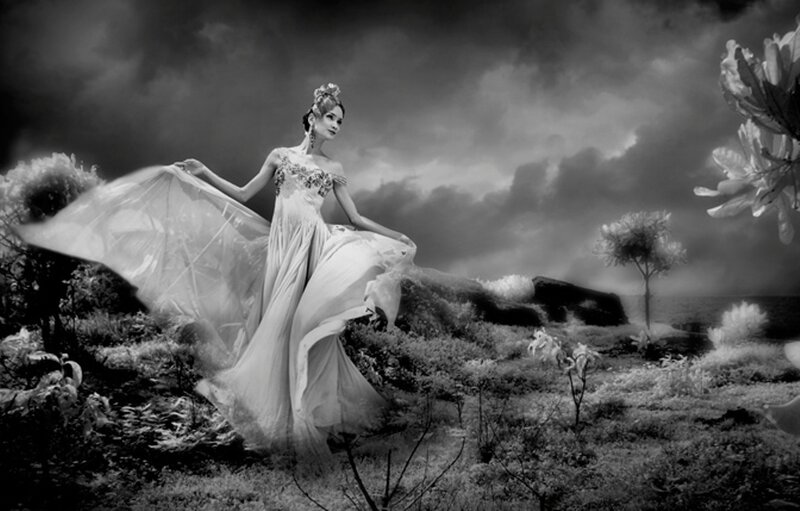 woman in flowing gown on hill