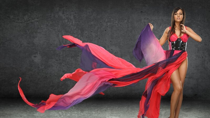 woman in flowing red and purple dress
