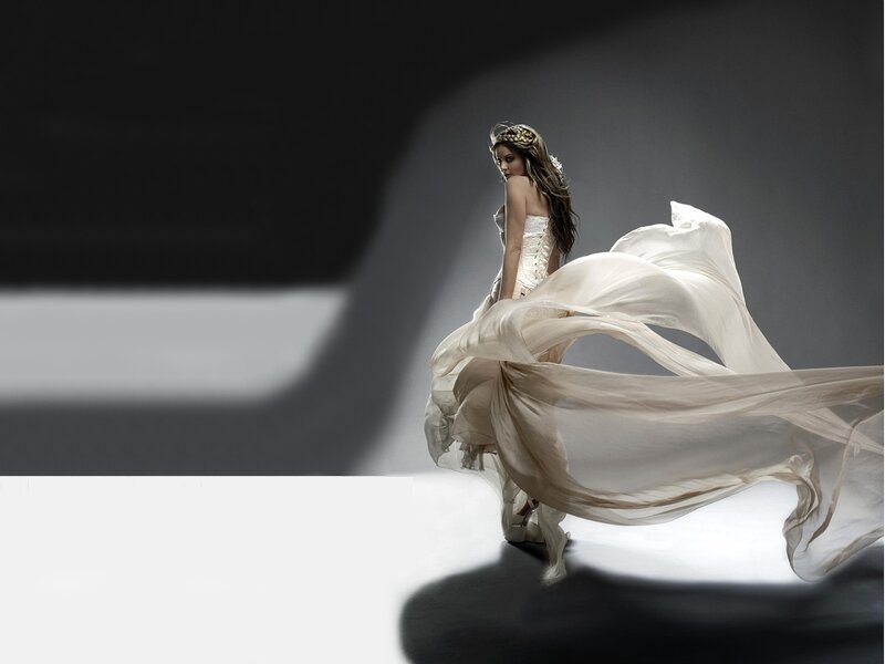 Woman in Flowing White Dress — Dramatic