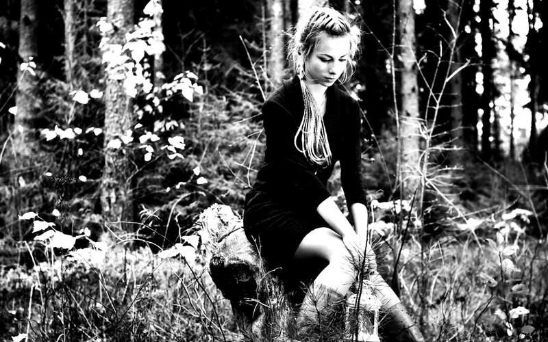 woman in forest at dusk