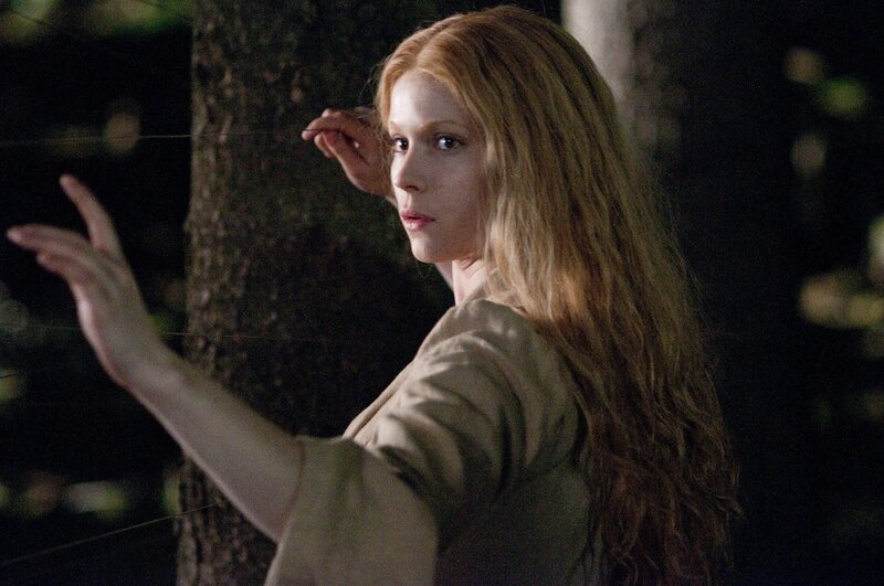 woman in forest at night
