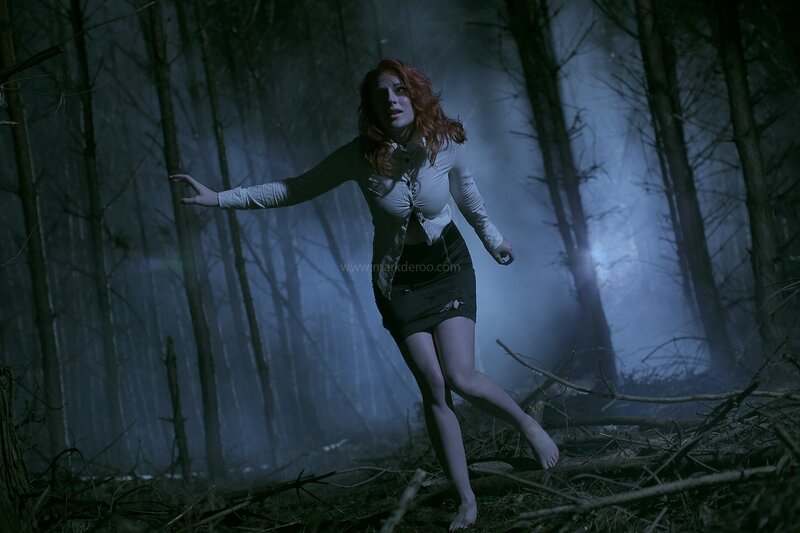 woman in forest at night