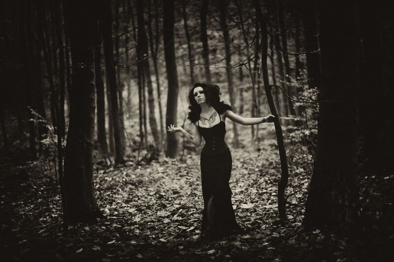 woman in forest at night