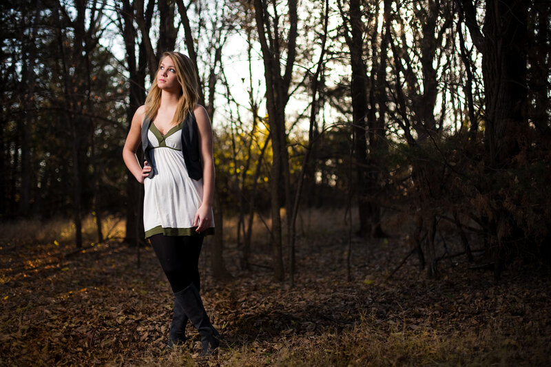 woman in forest at sunset