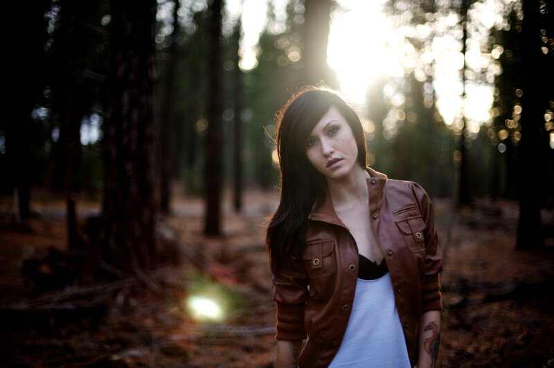 woman in forest at sunset