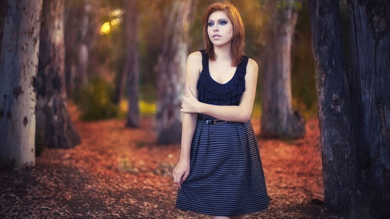 woman in forest at sunset