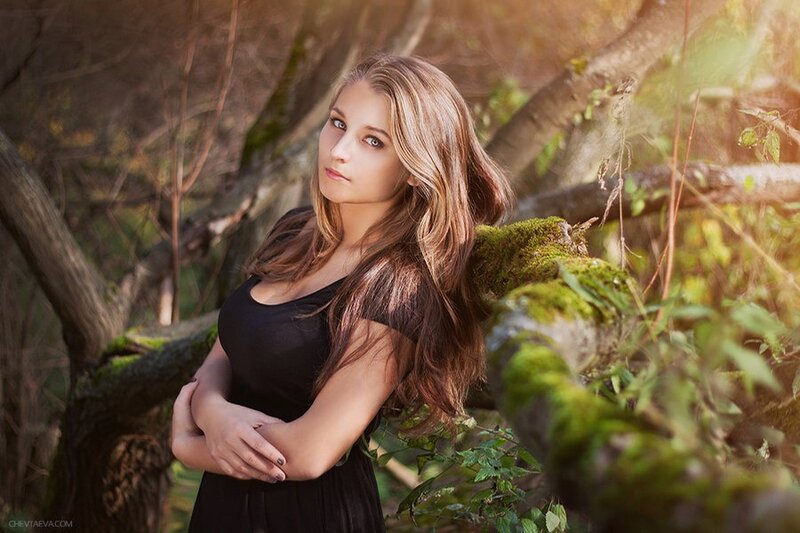 woman in forest at sunset