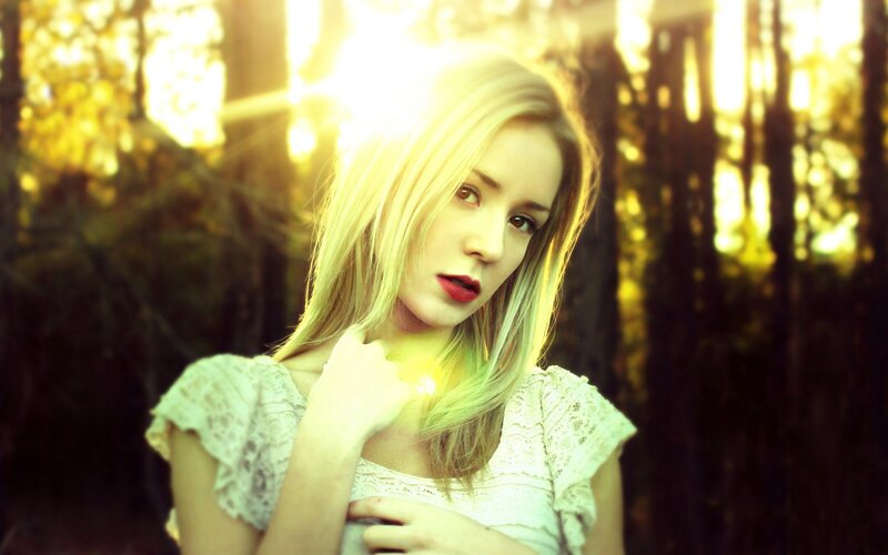 woman in forest at sunset