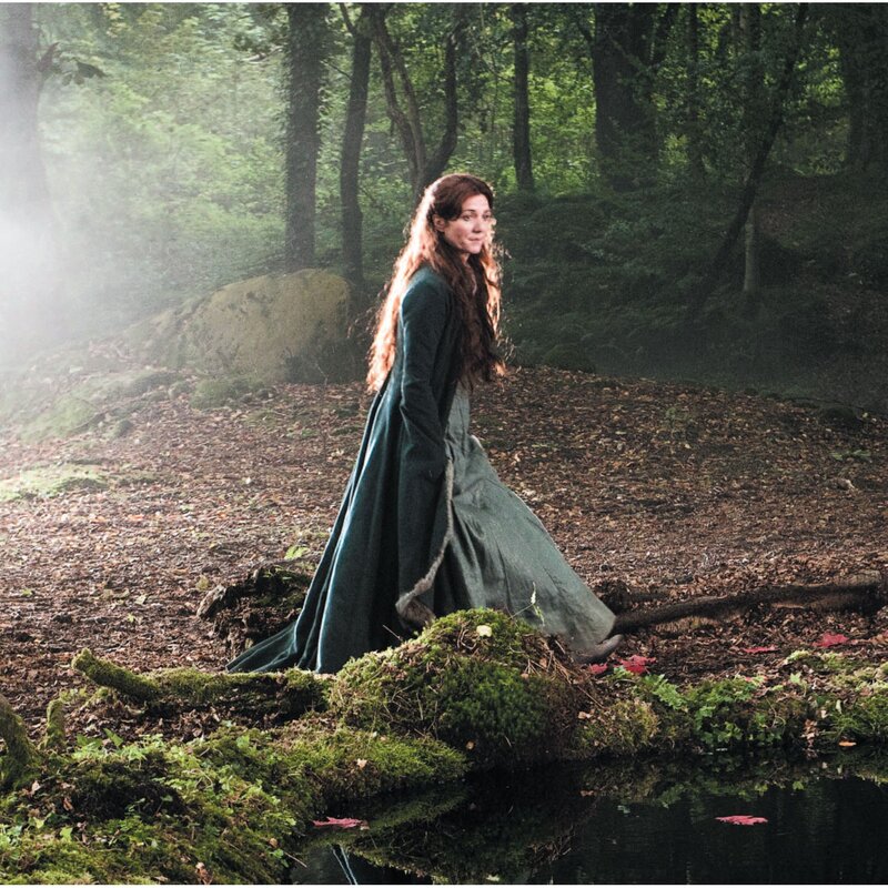 woman in forest by pond