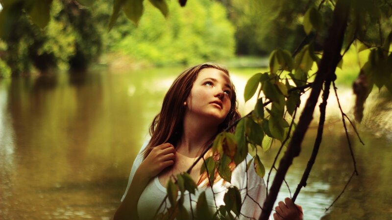 woman in forest by river