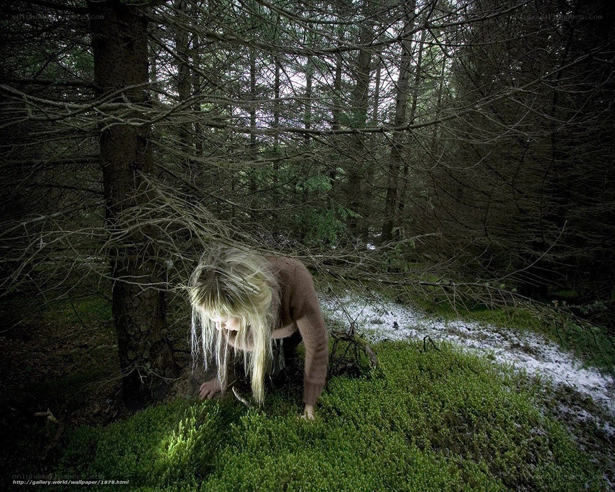 Woman in forest clearing