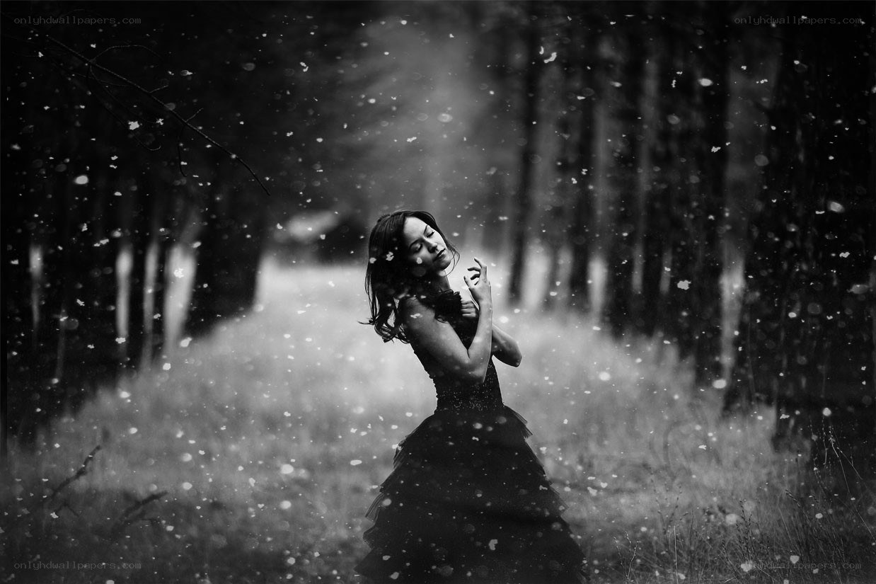 woman in forest during snowfall