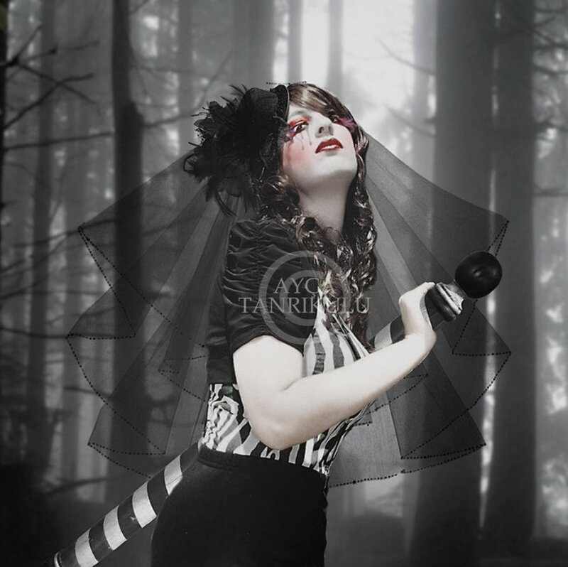 Woman in Forest Holding Sword