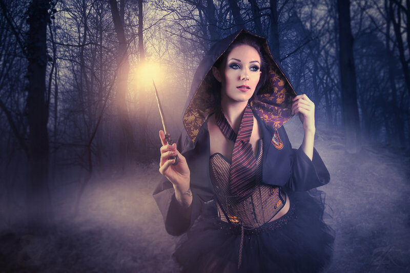 Woman in Forest Holding Wand