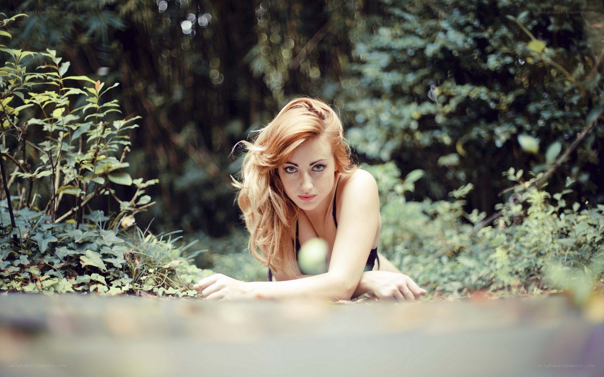 woman in forest looking at camera