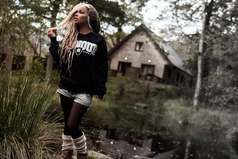 woman in forest near cabin