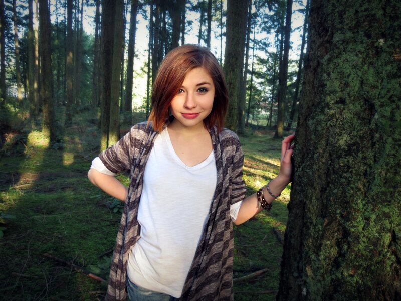 woman in forest near tree