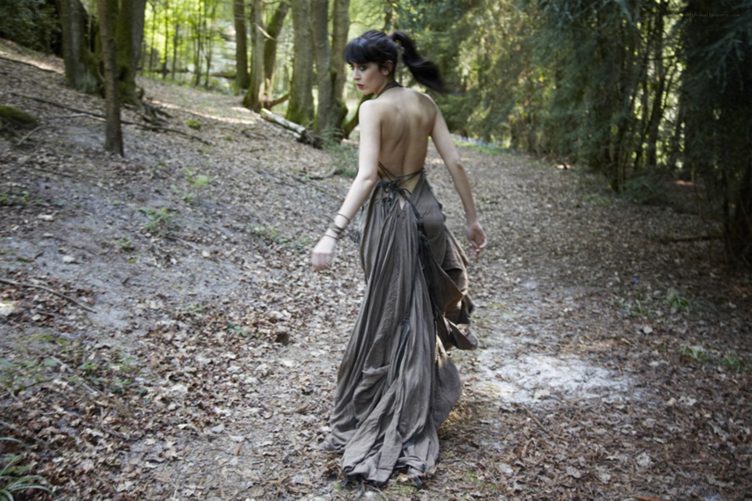 Woman in forest path