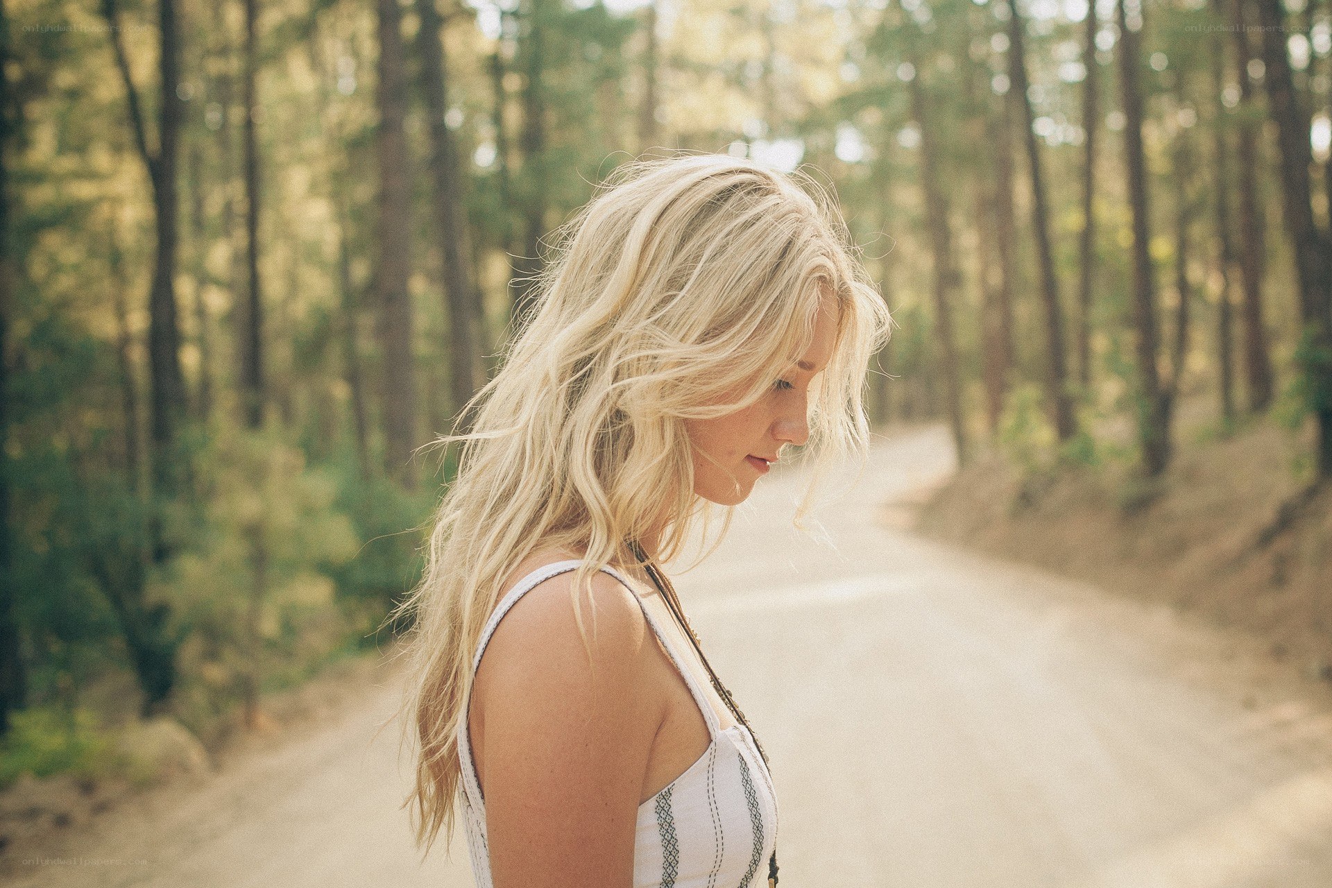 woman in forest path