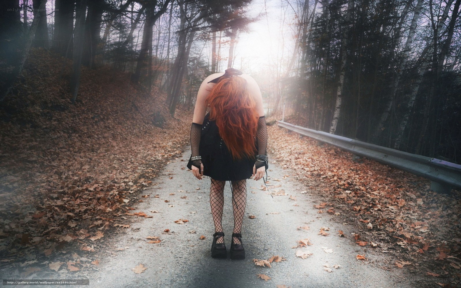 woman in forest path