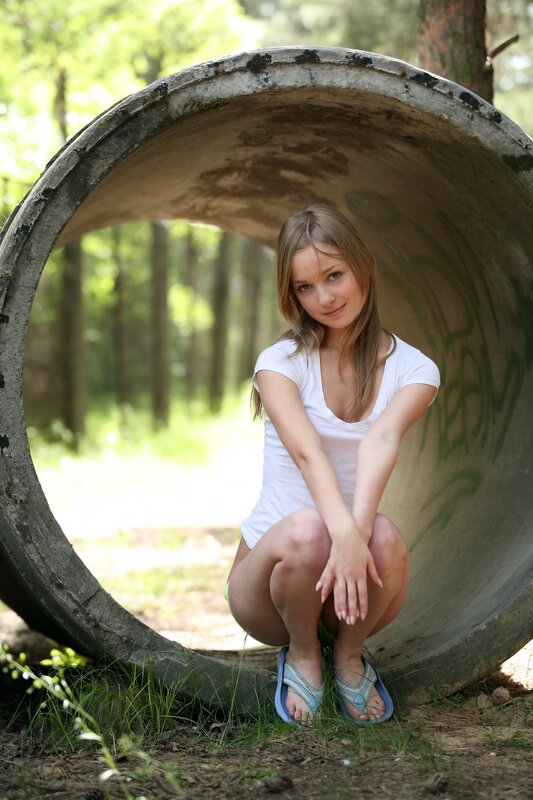 Woman in forest tunnel