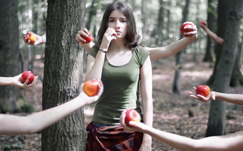 woman in forest with apples