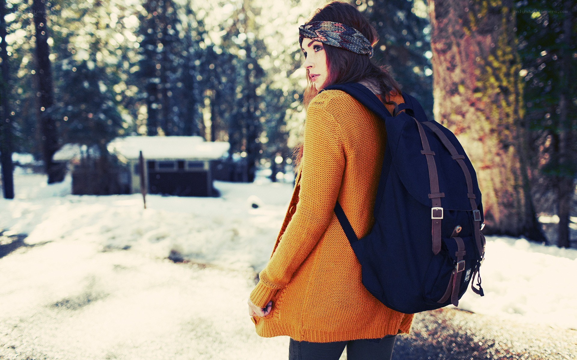 Woman in forest with backpack
