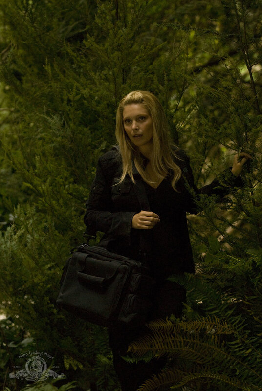 Woman in forest with bag