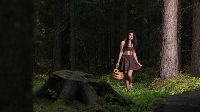 Woman in forest with basket