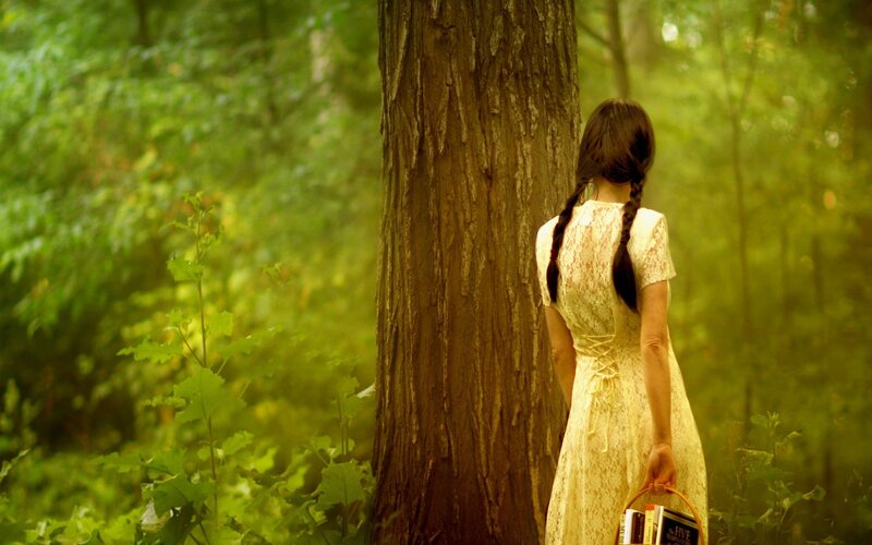 woman in forest with basket