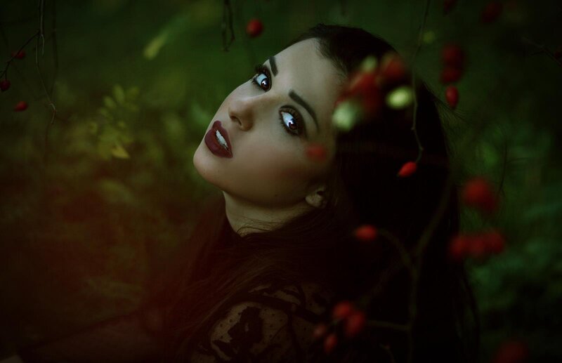 woman in forest with berries