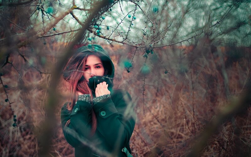 woman in forest with berries