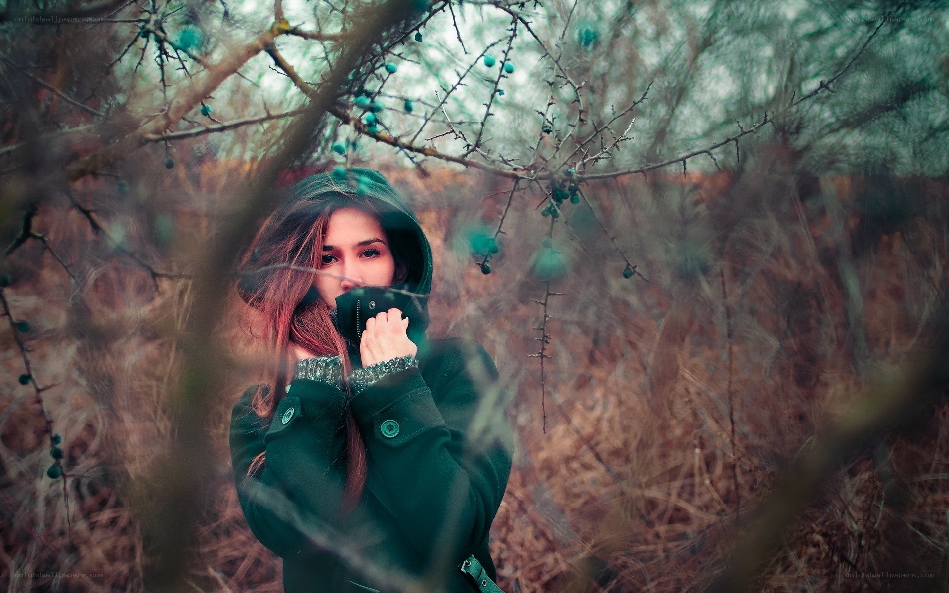woman in forest with berries