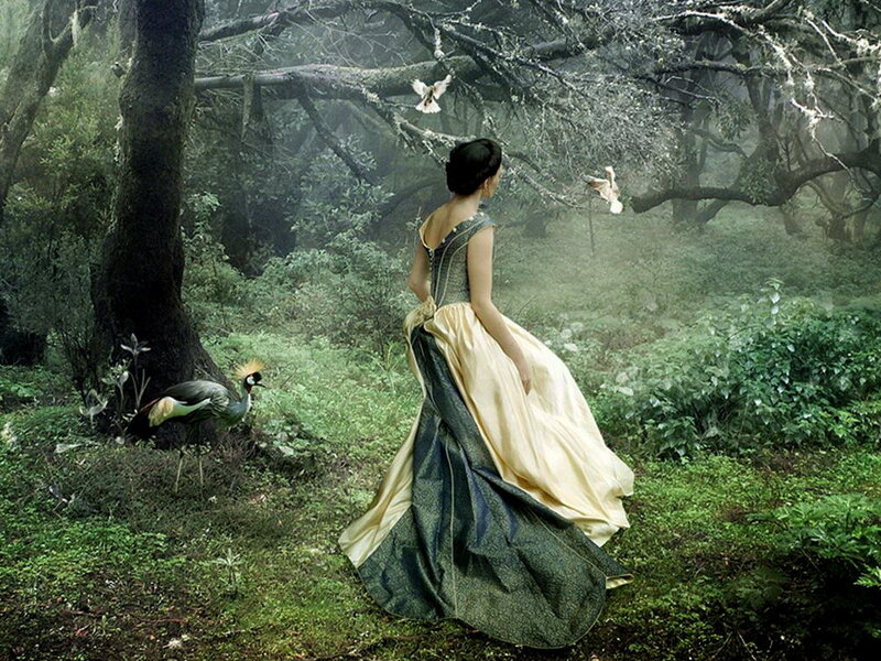 woman in forest with birds