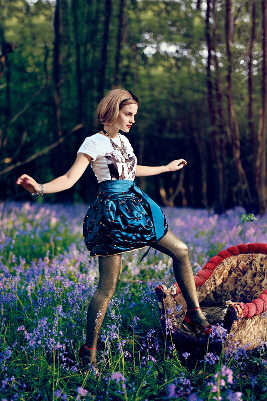 Woman in forest with bluebells