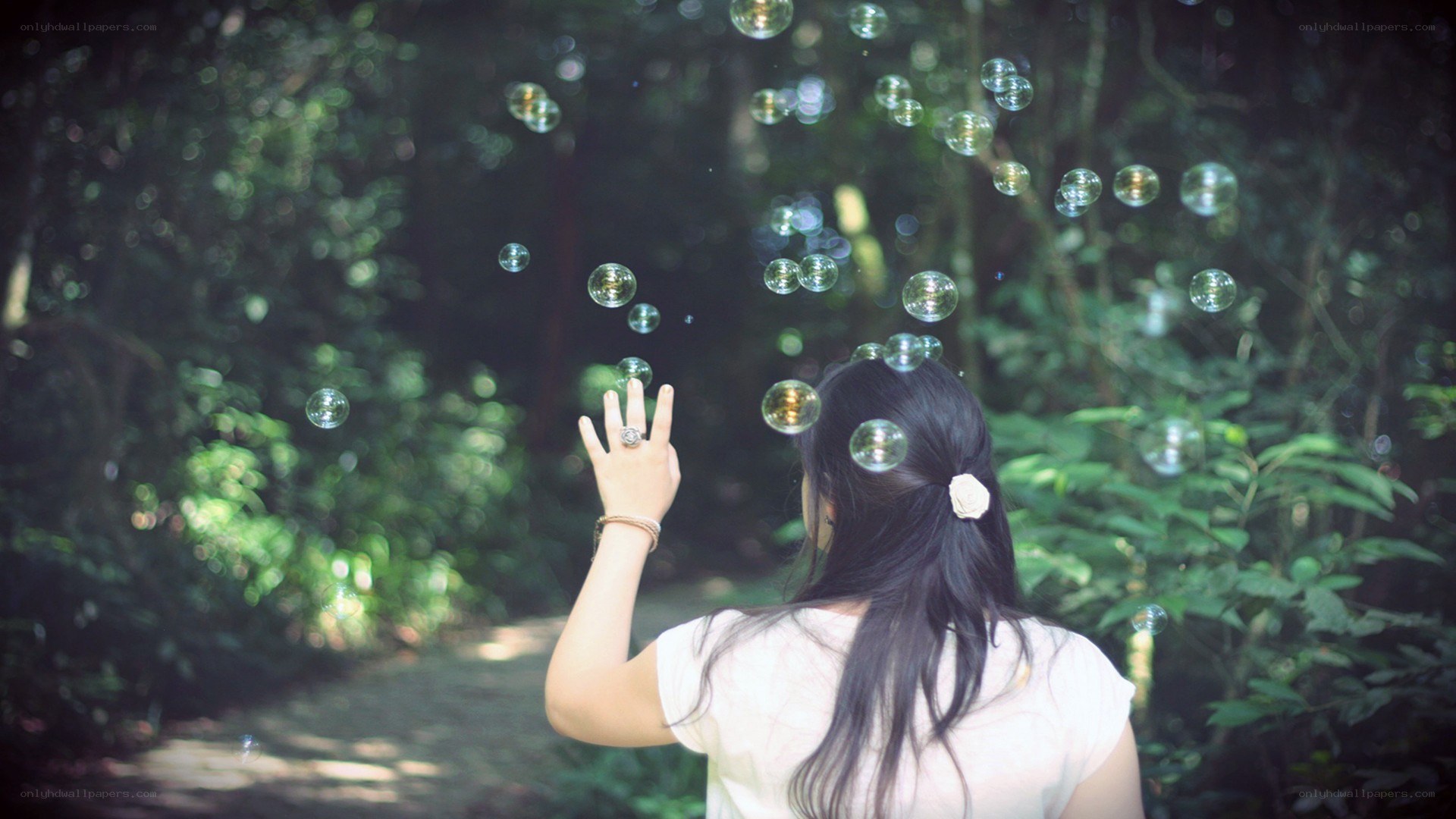 woman in forest with bubbles