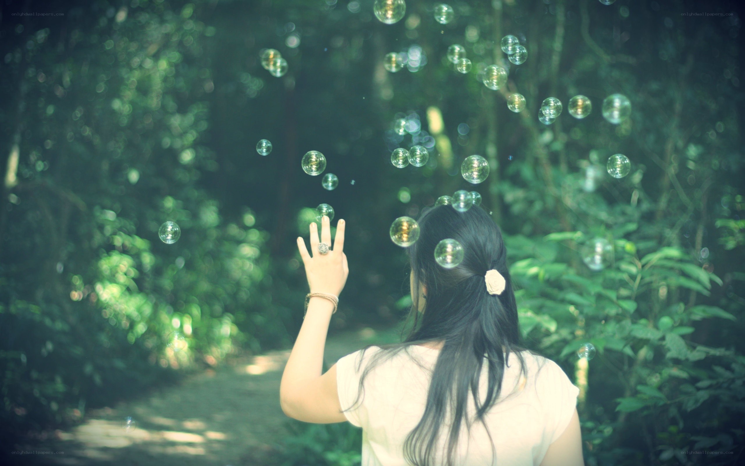 woman in forest with bubbles