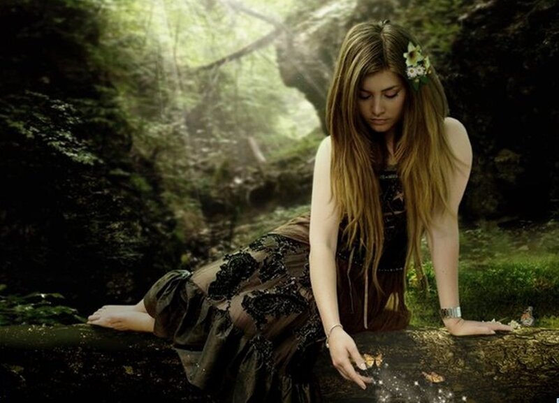 woman in forest with butterflies